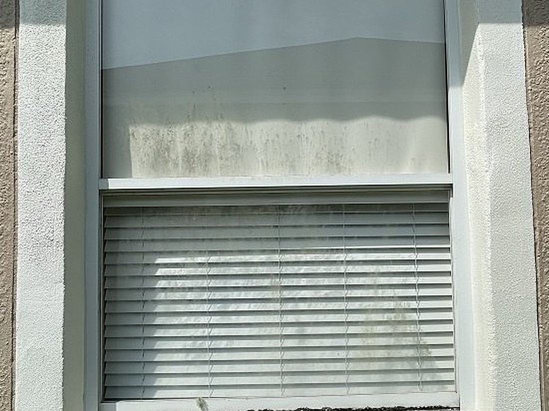 Window before cleaning — same window, frames registered to the after photo